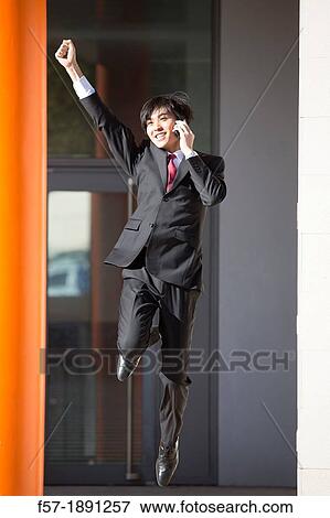Young Asian businessman jumping for joy View Large Photo Image Stock Photo - Young Asian businessman jumping for joy. Fotosearch