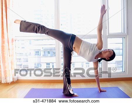 young asian girl practicing yoga at home View Large Photo Image Picture - young asian girl practicing yoga at home. Fotosearch