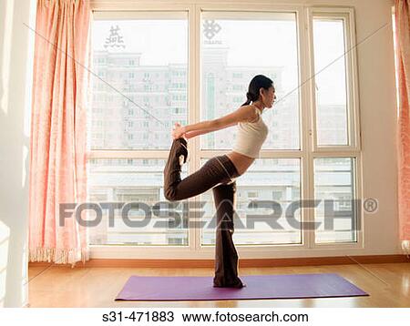 young asian girl practicing yoga at home View Large Photo Image Stock Image - young asian girl practicing yoga at home. Fotosearch