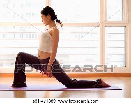 young asian girl practicing yoga at home View Large Photo Image Stock Photo - young asian girl practicing yoga at home. Fotosearch