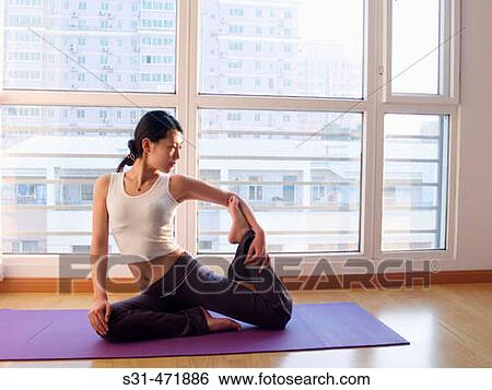 young asian girl practicing yoga at home View Large Photo Image Stock Photograph - young asian girl practicing yoga at home. Fotosearch