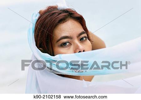 Young asian woman playing with a white tissue, Bali, Indonesia, Southeast Asia. View Large Photo Image Stock Photo - Young asian woman playing with a white tissue, Bali, Indonesia, Southeast Asia.. Fotosearch