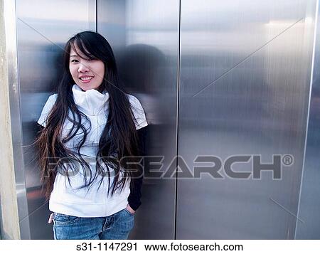 Young asian woman posing View Large Photo Image Stock Image - Young asian woman posing. Fotosearch