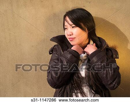 Young asian woman posing View Large Photo Image Stock Photograph - Young asian woman posing. Fotosearch