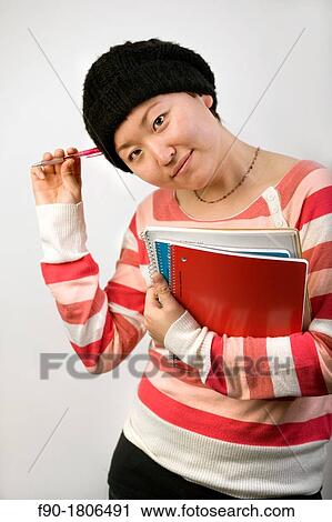 Stock Image - Young Asian woman student. Fotosearch