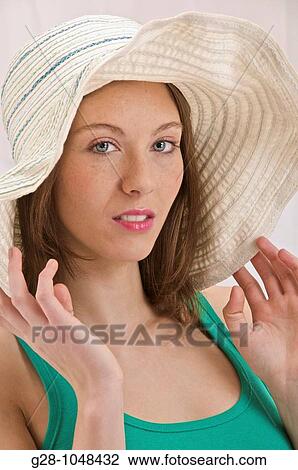 young attractive woman in sunhat View Large Photo Image Stock Image - young attractive woman in sunhat. Fotosearch