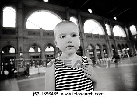 Young bald girl with pediatric cancer Leukimia looking somber in the Zurich train station, Switzerland View Large Photo Image Stock Photography - Young bald girl with pediatric cancer Leukimia looking somber in the Zurich train station, Switzerland. Fotosearch