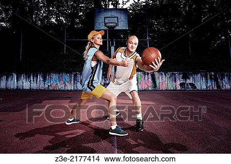 young basketball players on a street basketball court. View Large Photo Image Picture - young basketball players on a street basketball court.. Fotosearch