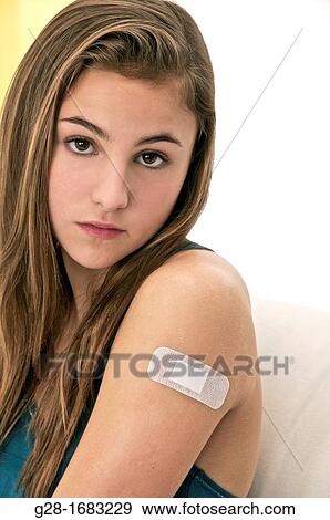 young beautiful teenage girl, with a bandage on her arm View Large Photo Image Stock Photo - young beautiful teenage girl, with a bandage on her arm. Fotosearch