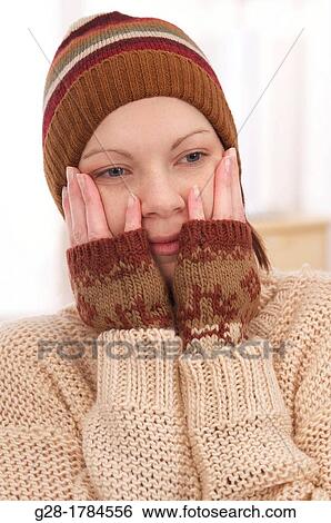 Young beautiful woman in winter woolen hat and mittens View Large Photo Image Stock Photograph - Young beautiful woman in winter woolen hat and mittens. Fotosearch