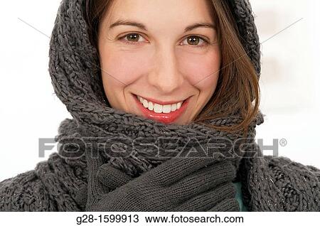 Young beautiful woman in woolen scarf, gloves and hat in winter View Large Photo Image Stock Image - Young beautiful woman in woolen scarf, gloves and hat in winter. Fotosearch