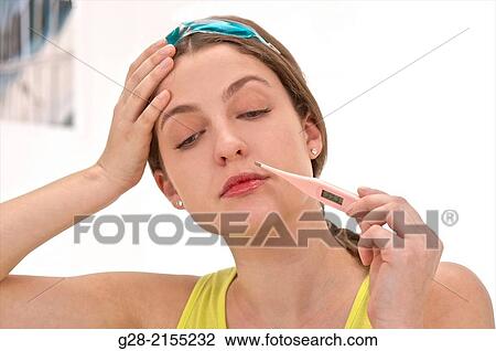 Young beautiful woman in yellow, with hot and cold pain relief mask upon her head, and hand on her forehead suffering from a headache, and thermometer in her mouth for temperature View Large Photo Image Stock Image - Young beautiful woman in yellow, with hot and cold pain relief mask upon her head, and hand on her forehead suffering from a headache, and thermometer in her mouth for temperature. Fotosearch