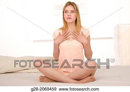 Young beautiful woman suffering from Angor, or practicing Yoga View Large Photo Image Stock Photo - Young beautiful woman suffering from Angor, or practicing Yoga. Fotosearch