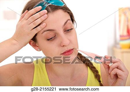 Young beautiful woman with a blue hot and cold mask to relieve pain and a headache View Large Photo Image Stock Image - Young beautiful woman with a blue hot and cold mask to relieve pain and a headache. Fotosearch