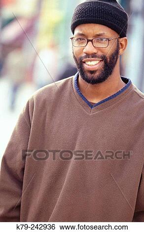 Stock Photograph - Young Black Man Smiling. Fotosearch
