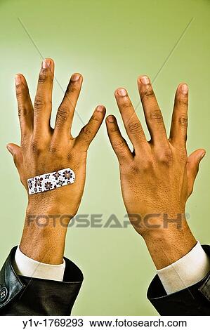 Young black man with colorful bandaid his hand View Large Photo Image Stock Image - Young black man with colorful bandaid his hand. Fotosearch