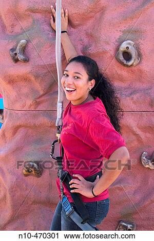 Young black woman Marine posing in front of a rock wall at a fair in Connecticut, USA View Large Photo Image Stock Image - Young black woman Marine posing in front of a rock wall at a fair in Connecticut, USA. Fotosearch