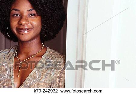 Young Black Woman Standing in Doorway Smiling View Large Photo Image Stock Image - Young Black Woman Standing in Doorway Smiling. Fotosearch