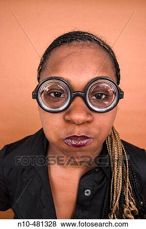 Young black woman wearing thick toy glasses View Large Photo Image Stock Photo - Young black woman wearing thick toy glasses. Fotosearch