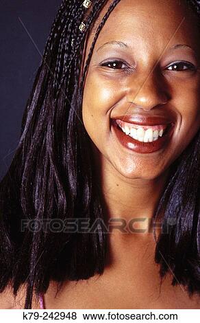 young black woman with braids smiling View Large Photo Image Stock Photo - young black woman with braids smiling. Fotosearch
