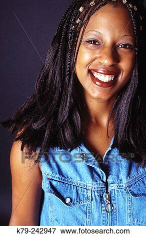 young black woman wtih braids smiling View Large Photo Image Stock Photo - young black woman wtih braids smiling. Fotosearch