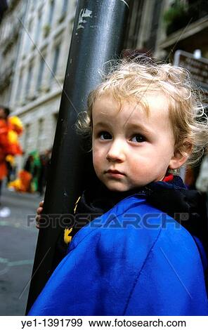 Young blond girl leaning on a lamppost in the street View Large Photo Image Stock Photo - Young blond girl leaning on a lamppost in the street. Fotosearch
