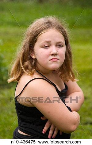 Young blond girl making a funny face for the camera. View Large Photo Image Stock Photography - Young blond girl making a funny face for the camera.. Fotosearch