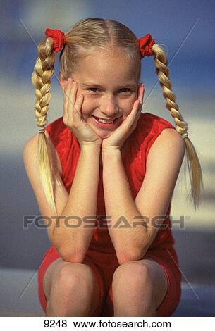 Young blond girl with braids View Large Photo Image Stock Photo - Young blond girl with braids. Fotosearch