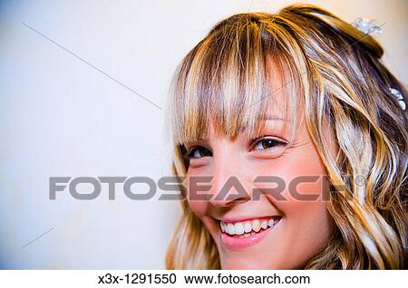 Young blond woman smiling View Large Photo Image Stock Image - Young blond woman smiling. Fotosearch