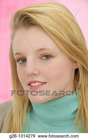 Young blond woman with long hair and smiling View Large Photo Image Stock Photo - Young blond woman with long hair and smiling. Fotosearch