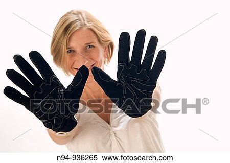 Young blonde girl showing the palms of the hands in black gloves. View Large Photo Image Stock Photography - Young blonde girl showing the palms of the hands in black gloves.. Fotosearch