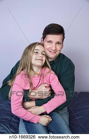 Young blonde girl with her father View Large Photo Image Stock Photograph - Young blonde girl with her father. Fotosearch
