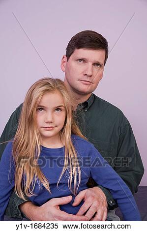 Stock Photography - Young blonde girl with her father. Fotosearch