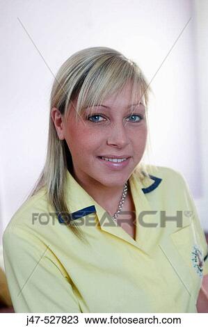 young blonde haired female nursery nurse, in her uniform, smiling into camera View Large Photo Image Stock Image - young blonde haired female nursery nurse, in her uniform, smiling into camera. Fotosearch