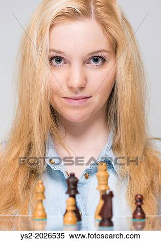 Young blonde woman and chess pieces. View Large Photo Image Stock Photography - Young blonde woman and chess pieces.. Fotosearch