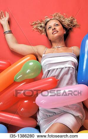 Young blonde woman with many colorful air baloons View Large Photo Image Stock Image - Young blonde woman with many colorful air baloons. Fotosearch