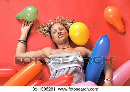 Young blonde woman with many colorful air baloons View Large Photo Image Stock Image - Young blonde woman with many colorful air baloons. Fotosearch