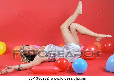 Young blonde woman with many colorful air baloons View Large Photo Image Stock Image - Young blonde woman with many colorful air baloons. Fotosearch