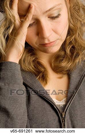 Young blonde woman worried, depressed anxious upset, looking down, View Large Photo Image Stock Image - Young blonde woman worried, depressed anxious upset, looking down,. Fotosearch