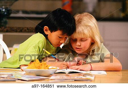 Young boy and girl doing homework View Large Photo Image Stock Image - Young boy and girl doing homework. Fotosearch