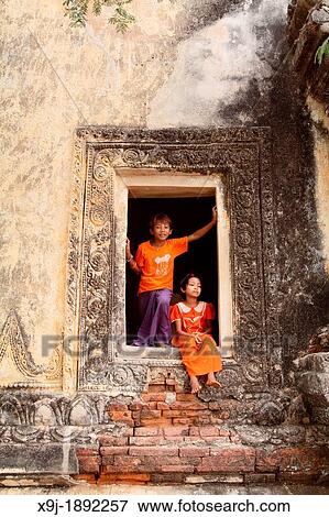 Young Boy and girl Playing near Temple in Bagan, Myanmar, Burma View Large Photo Image Stock Photo - Young Boy and girl Playing near Temple in Bagan, Myanmar, Burma. Fotosearch