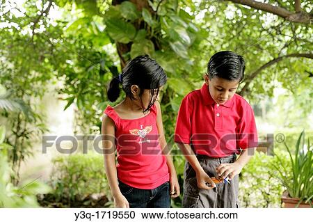 young boy and girl share a happy childhood moment together View Large Photo Image Stock Image - young boy and girl share a happy childhood moment together. Fotosearch