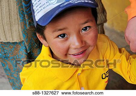 Young boy at Hemis Gompa during the Musk dance Festival. Jammu and Kashmir, India View Large Photo Image Stock Photo - Young boy at Hemis Gompa during the Musk dance Festival. Jammu and Kashmir, India. Fotosearch