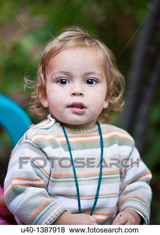 Young boy biting lip View Large Photo Image Stock Photo - Young boy biting lip. Fotosearch