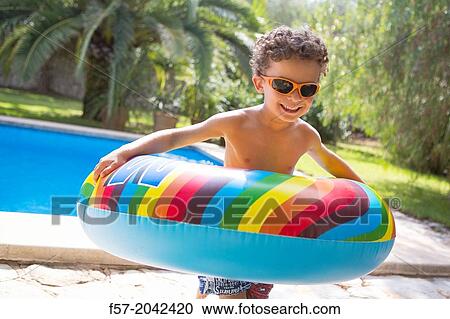 Stock Image - Young boy enjoys summer.. Fotosearch