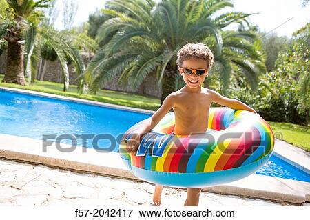 Stock Photo - Young boy enjoys summer.. Fotosearch