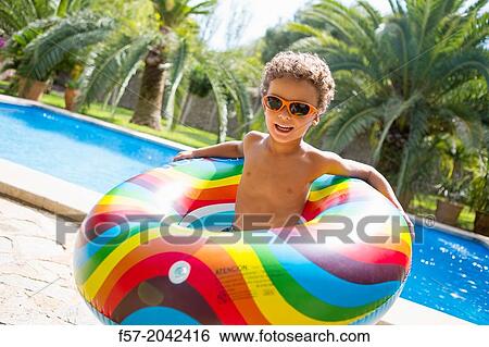 Stock Photograph - Young boy enjoys summer.. Fotosearch