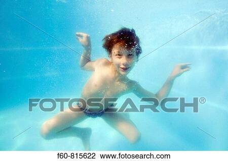 Young boy having underwater fun in the family pool, Guararema, Sao Paulo, Brazil View Large Photo Image Stock Image - Young boy having underwater fun in the family pool, Guararema, Sao Paulo, Brazil. Fotosearch