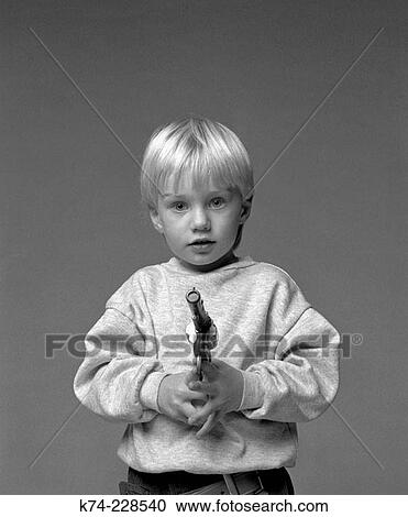 Young Boy Holding Toy Gun View Large Photo Image Stock Image - Young Boy Holding Toy Gun. Fotosearch