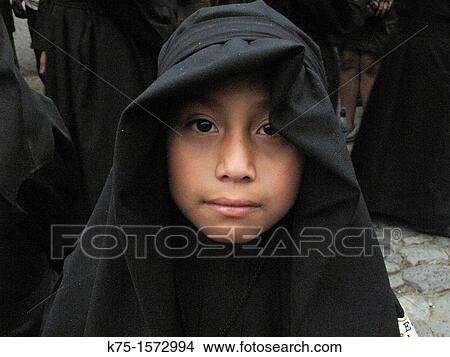 Young boy in black robe for procession during Holy Week View Large Photo Image Picture - Young boy in black robe for procession during Holy Week. Fotosearch